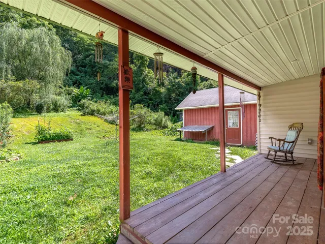 a view of a backyard with wooden floor and roof