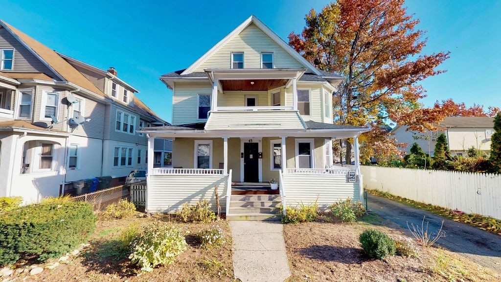 43 Longfellow Terrace Springfield, MA 01108 - Photo 1 of 25 a front view of a house with a yard
