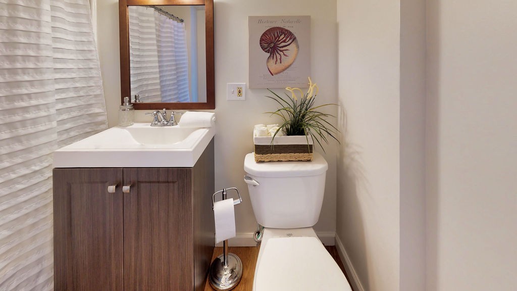 43 Longfellow Terrace Springfield, MA 01108 - Photo 14 of 25 a bathroom with a toilet sink and mirror