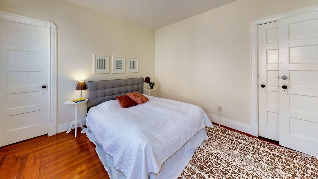 43 Longfellow Terrace Springfield, MA 01108 - Photo 16 of 25 a bedroom with a bed and wooden floor