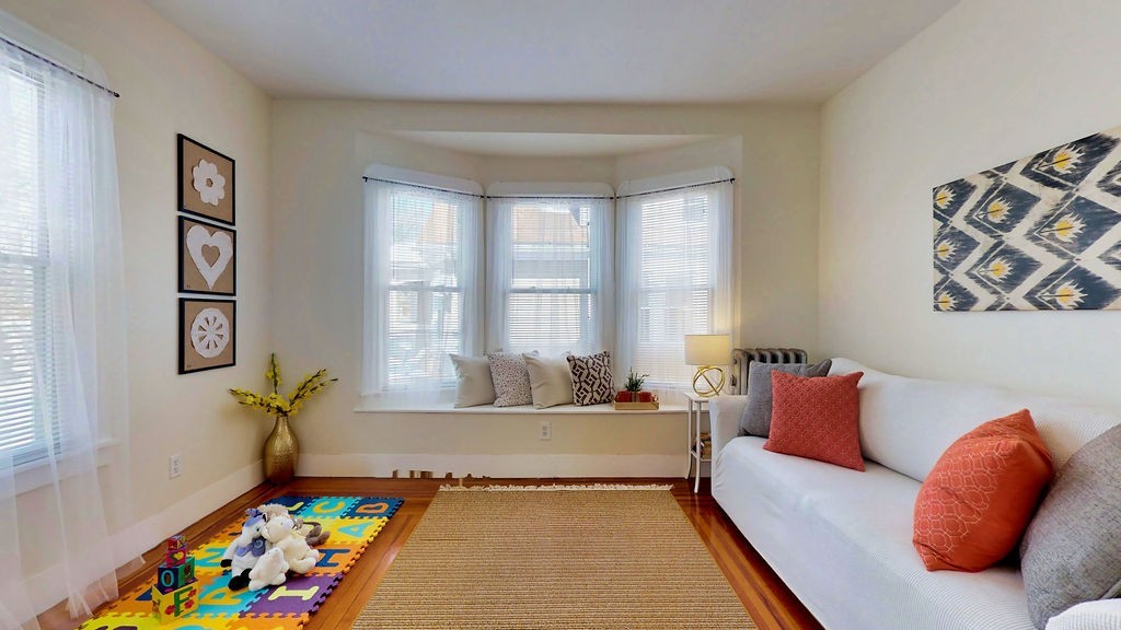 43 Longfellow Terrace Springfield, MA 01108 - Photo 18 of 25 a living room with furniture and a window