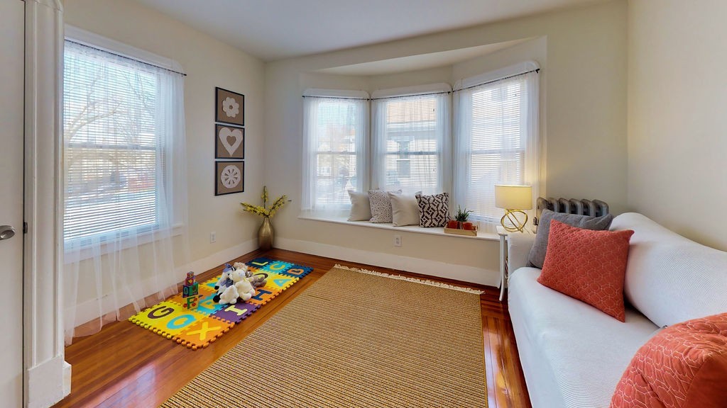 43 Longfellow Terrace Springfield, MA 01108 - Photo 19 of 25 a spacious bedroom with a bed and a window