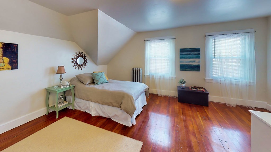 43 Longfellow Terrace Springfield, MA 01108 - Photo 20 of 25 a bedroom with a bed and wooden floor