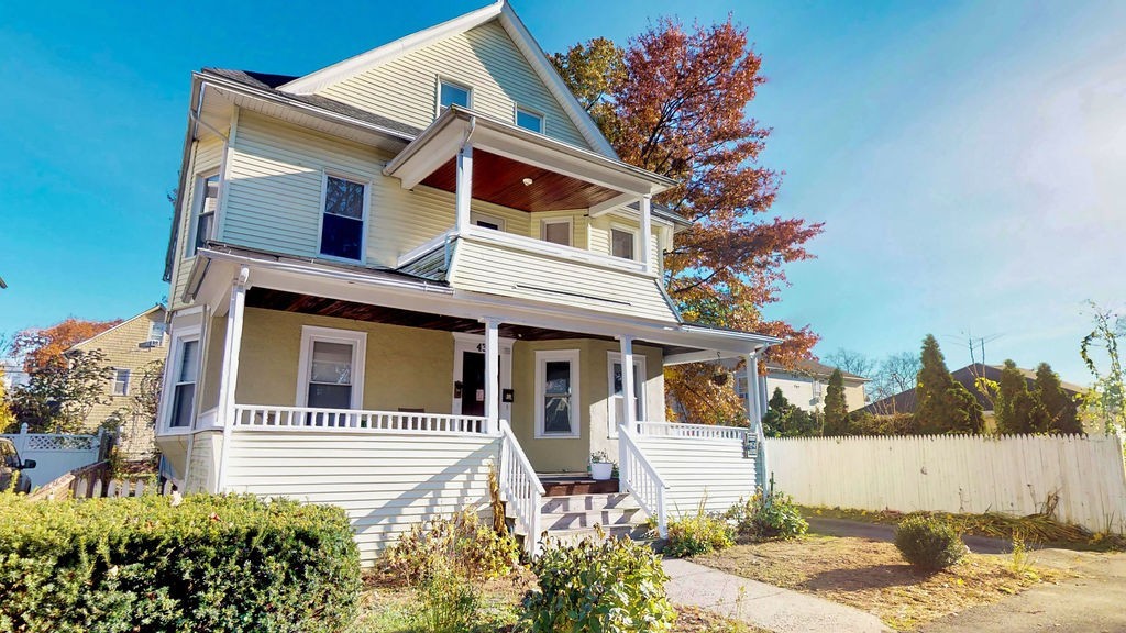 43 Longfellow Terrace Springfield, MA 01108 - Photo 2 of 25 a front view of a house with a yard