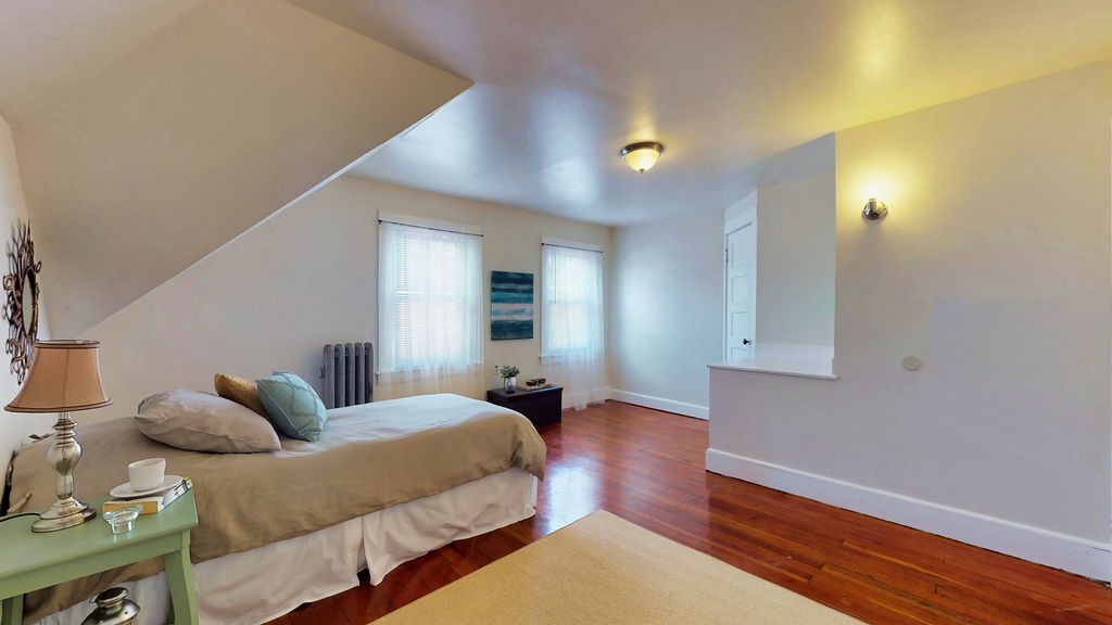 43 Longfellow Terrace Springfield, MA 01108 - Photo 21 of 25 a spacious bedroom with a bed and wooden floor