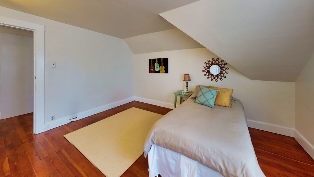 43 Longfellow Terrace Springfield, MA 01108 - Photo 22 of 25 a bedroom with a bed and wooden floor