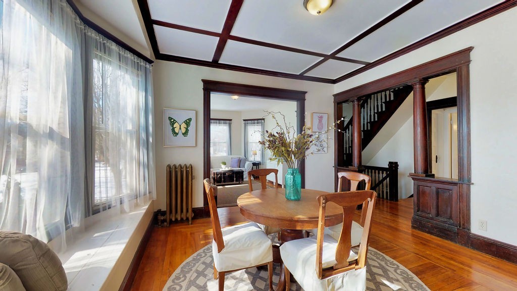 43 Longfellow Terrace Springfield, MA 01108 - Photo 7 of 25 a dining room with furniture a chandelier and wooden floor