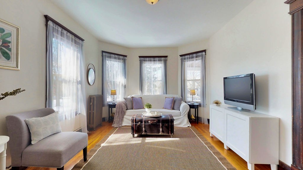 43 Longfellow Terrace Springfield, MA 01108 - Photo 10 of 25 a living room with furniture and a flat screen tv