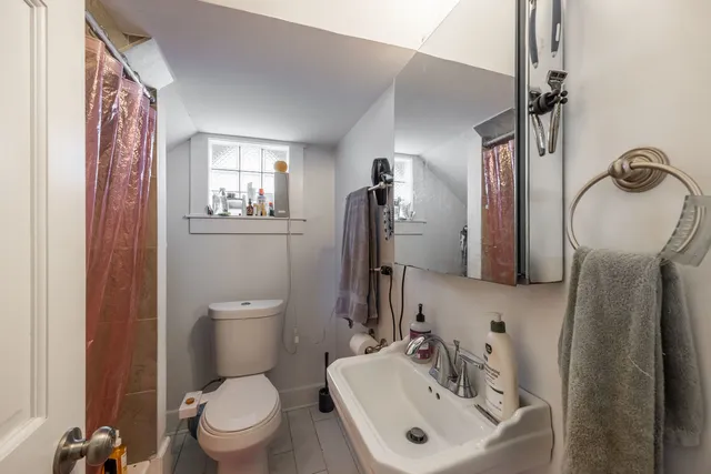 a bedroom with furniture and a flat screen tv