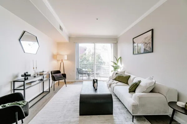 a living room with furniture and a large window
