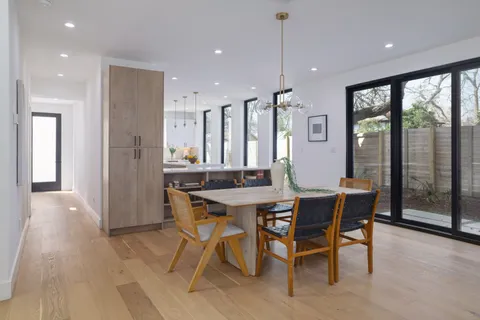 a kitchen with cabinets a sink and appliances