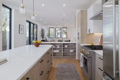 a bathroom with a sink a mirror and a shower