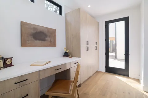 a bedroom with a bed and a night stand