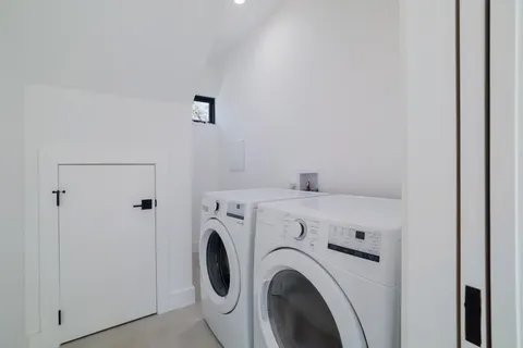 a kitchen with a refrigerator and a sink