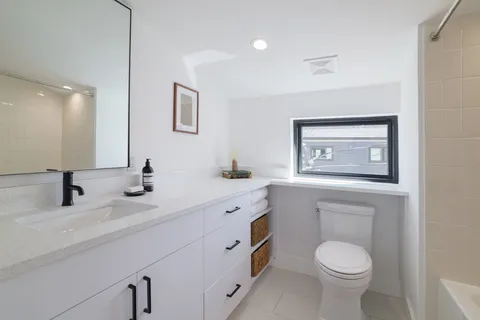 a view of a building with a large tree