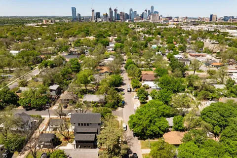 a view of a house with brick walls
