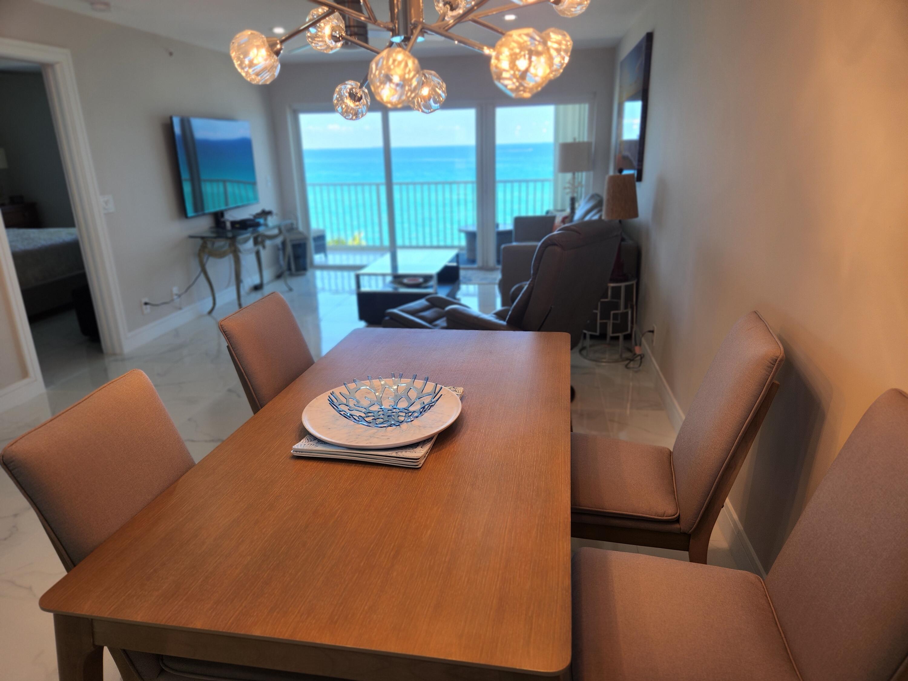 3101 South Ocean Boulevard, Unit 812 Highland Beach, FL 33487 - Photo 11 of 24 a view of a dining room with furniture