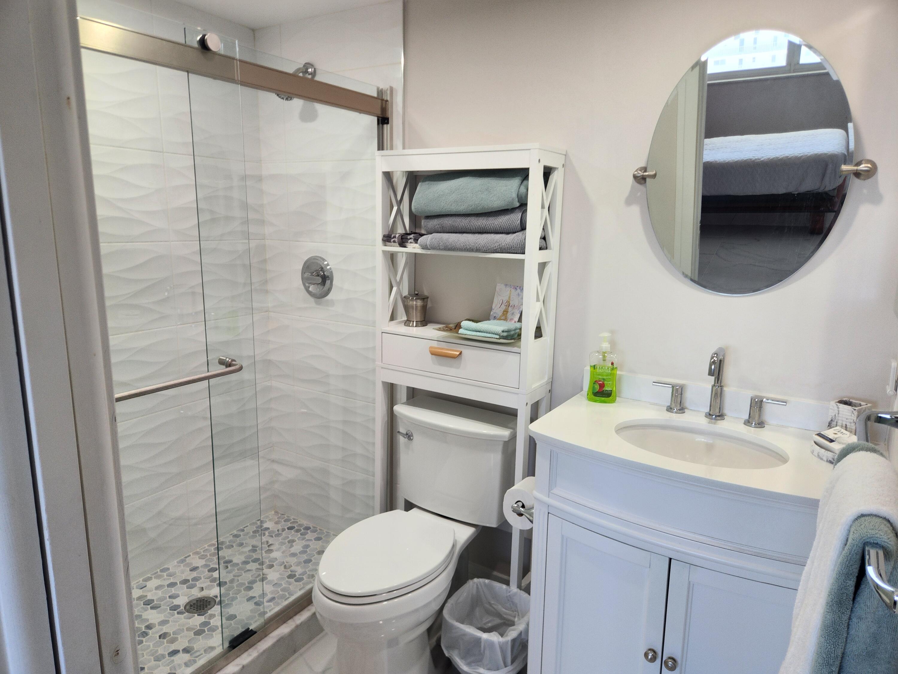 3101 South Ocean Boulevard, Unit 812 Highland Beach, FL 33487 - Photo 15 of 24 a bathroom with a sink toilet and shower