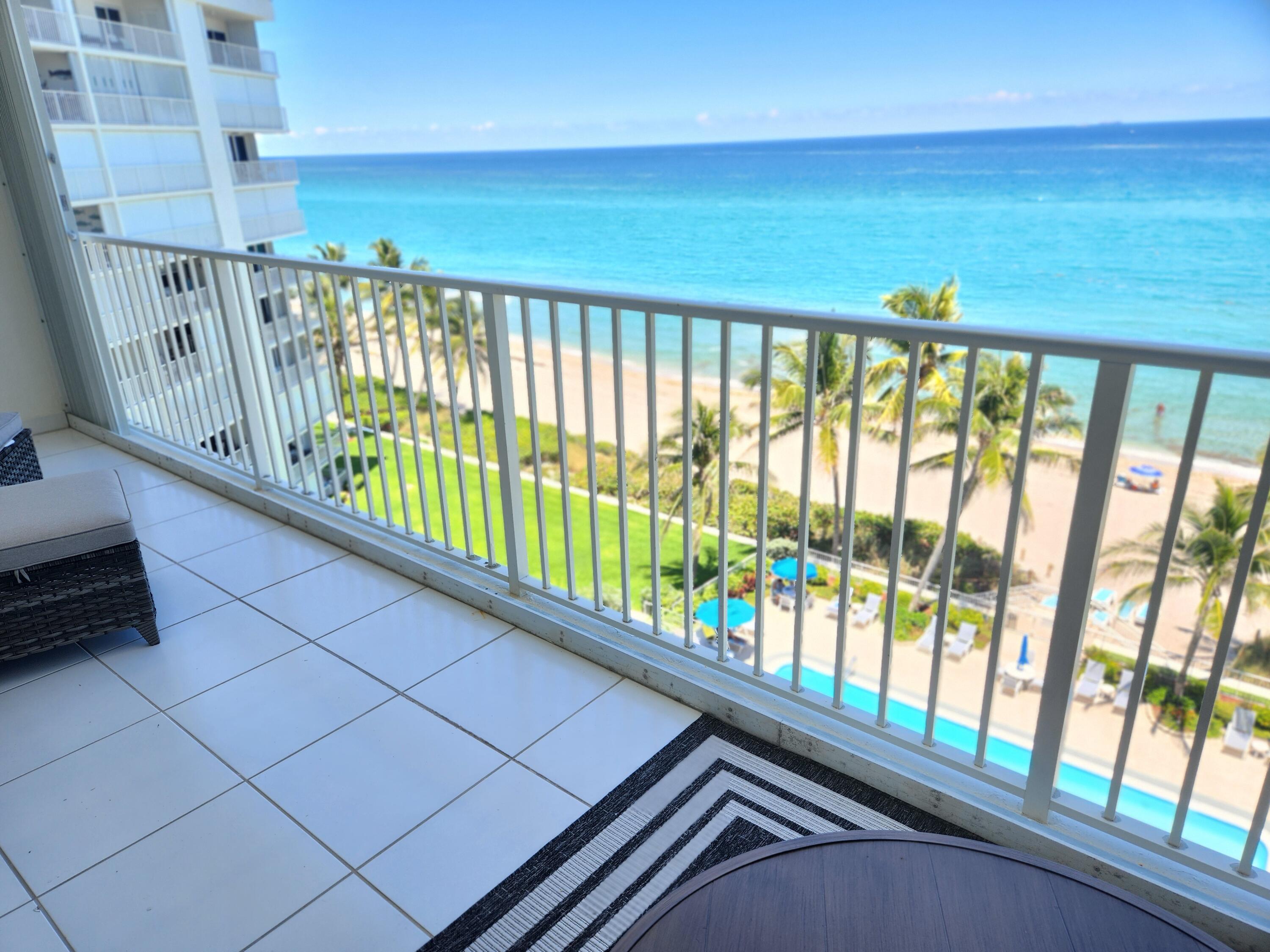 3101 South Ocean Boulevard, Unit 812 Highland Beach, FL 33487 - Photo 4 of 24 a view of a balcony with wooden floor