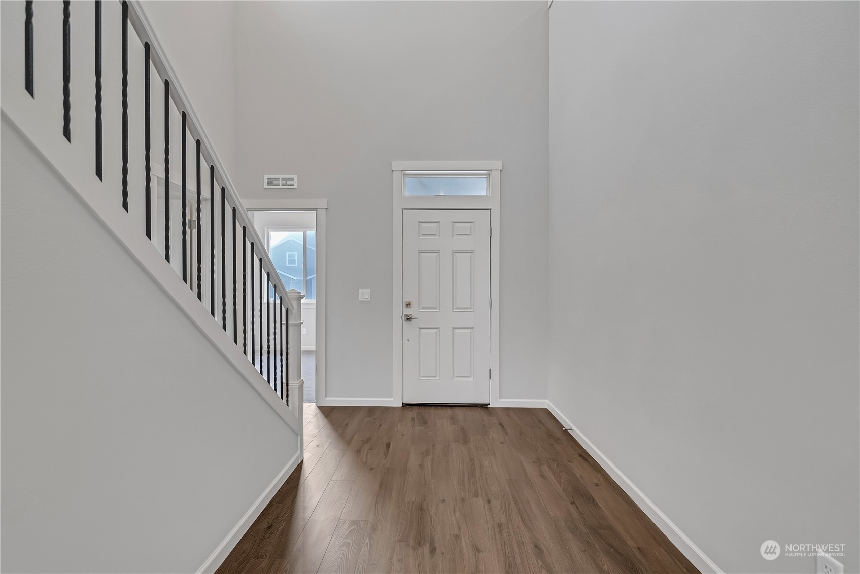 2719 South 9th Circle Ridgefield, WA 98642 - Photo 14 of 16 a view of a hallway with wooden floor and entryway