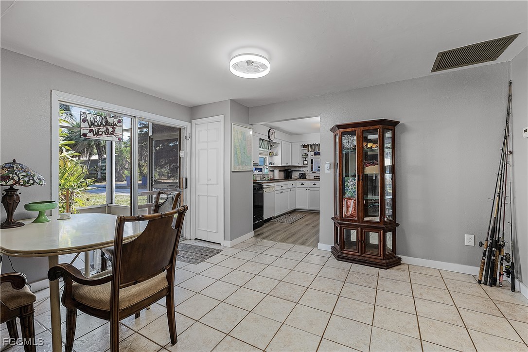 15925 Quail Trail Bokeelia, FL 33922 - Photo 12 of 26 a dining room with furniture and window