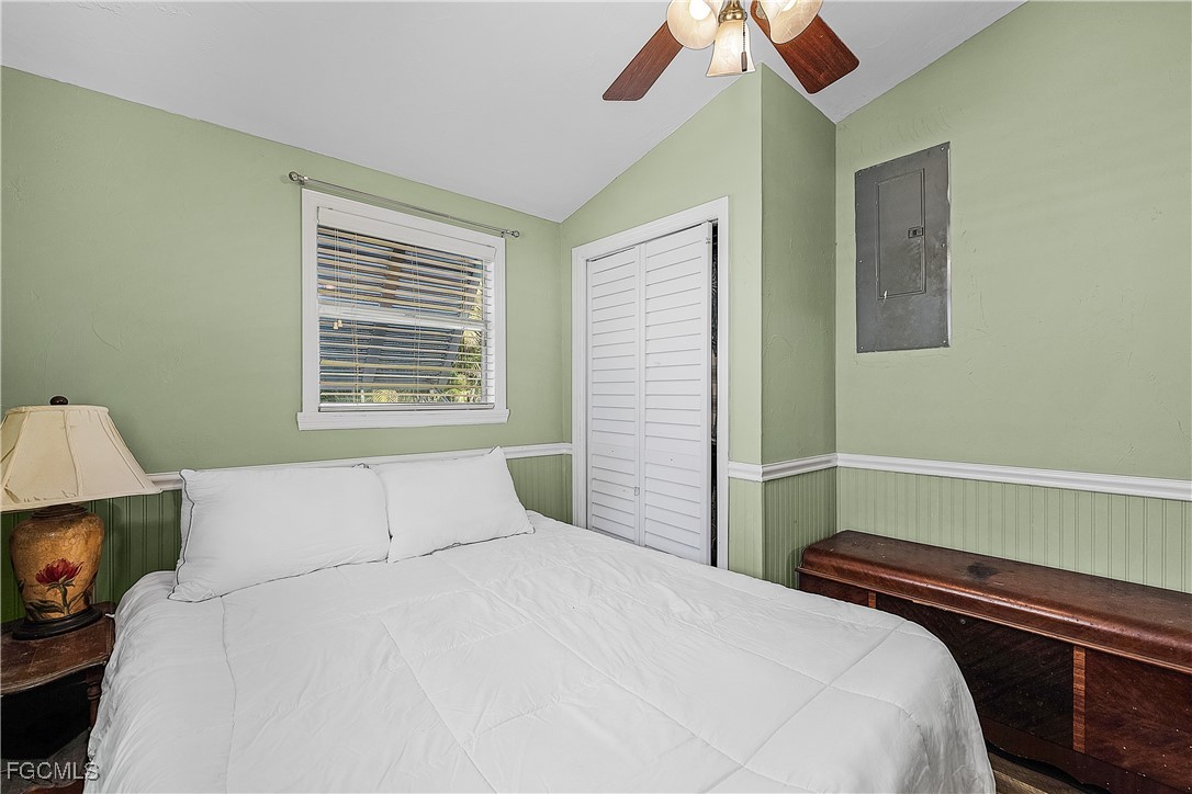 15925 Quail Trail Bokeelia, FL 33922 - Photo 15 of 26 a bedroom with a bed and a window