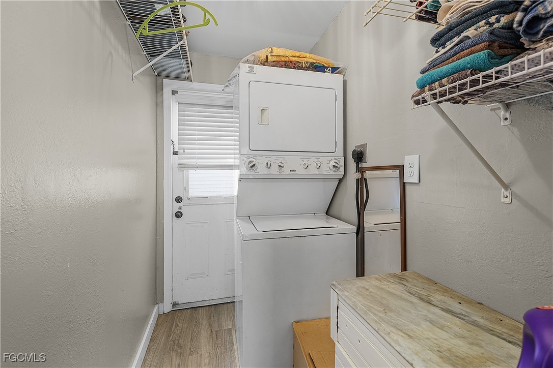 15925 Quail Trail Bokeelia, FL 33922 - Photo 17 of 26 a utility room with dryer and washer
