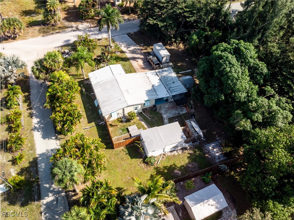 15925 Quail Trail Bokeelia, FL 33922 - Photo 2 of 26 an aerial view of residential house with outdoor space and swimming pool