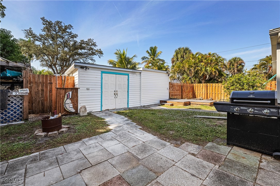 15925 Quail Trail Bokeelia, FL 33922 - Photo 22 of 26 a backyard of a house with lots of green space