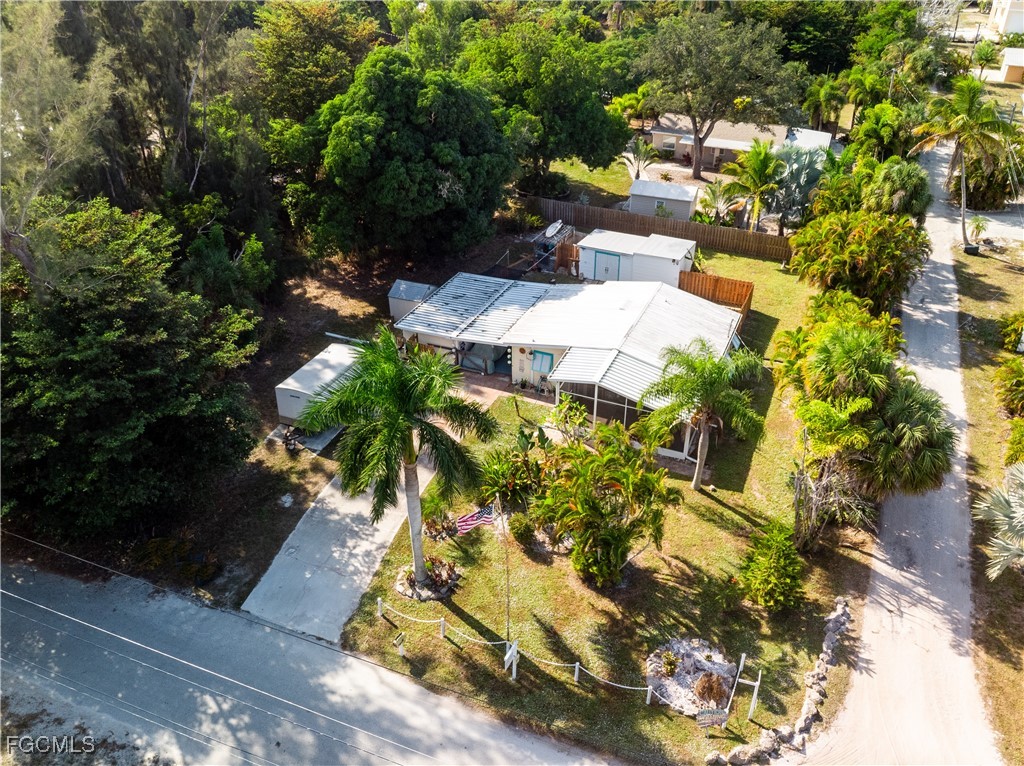 15925 Quail Trail Bokeelia, FL 33922 - Photo 24 of 26 a view of a yard with plants