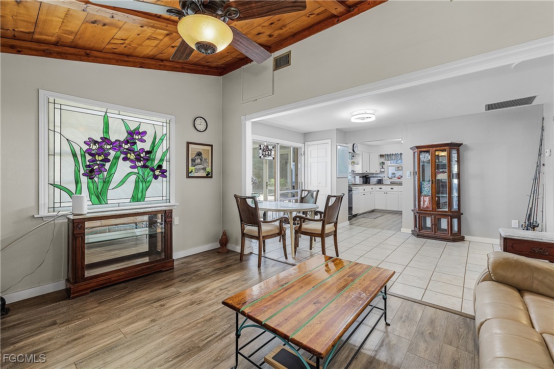 15925 Quail Trail Bokeelia, FL 33922 - Photo 5 of 26 a living room with furniture and a flat screen tv
