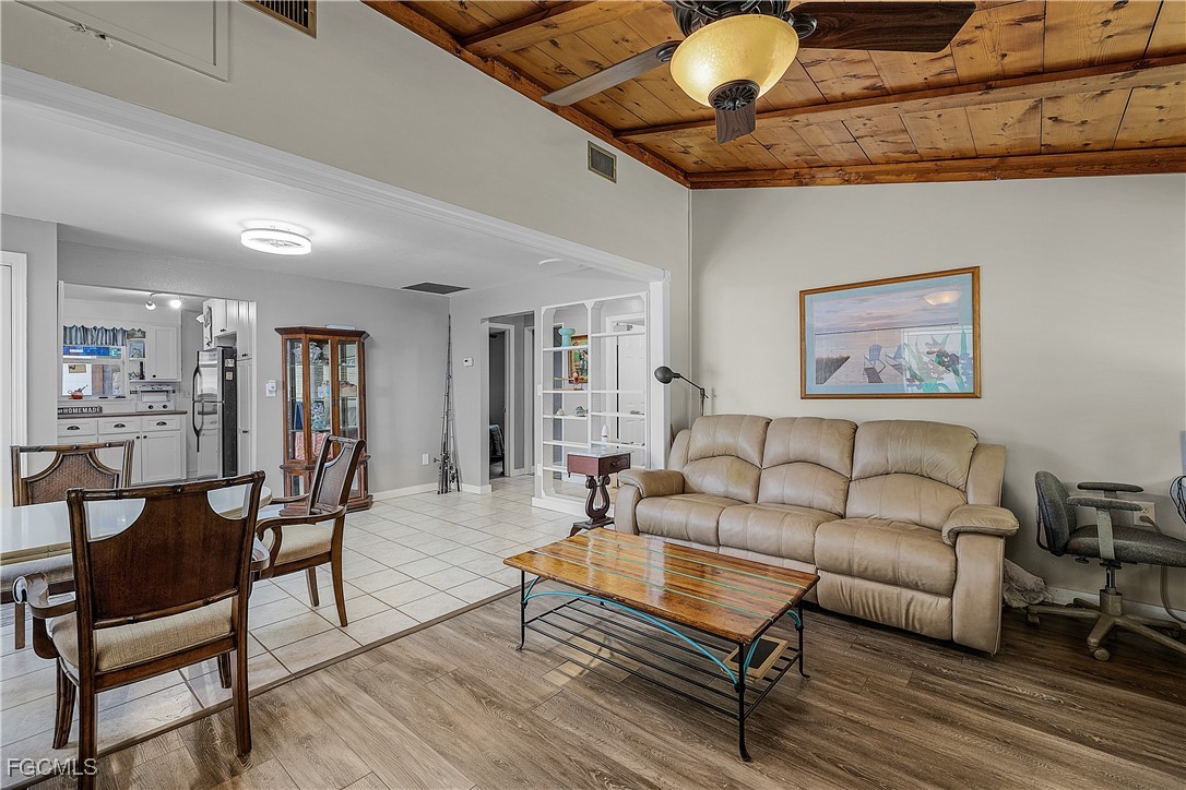 15925 Quail Trail Bokeelia, FL 33922 - Photo 6 of 26 a living room with furniture and wooden floor