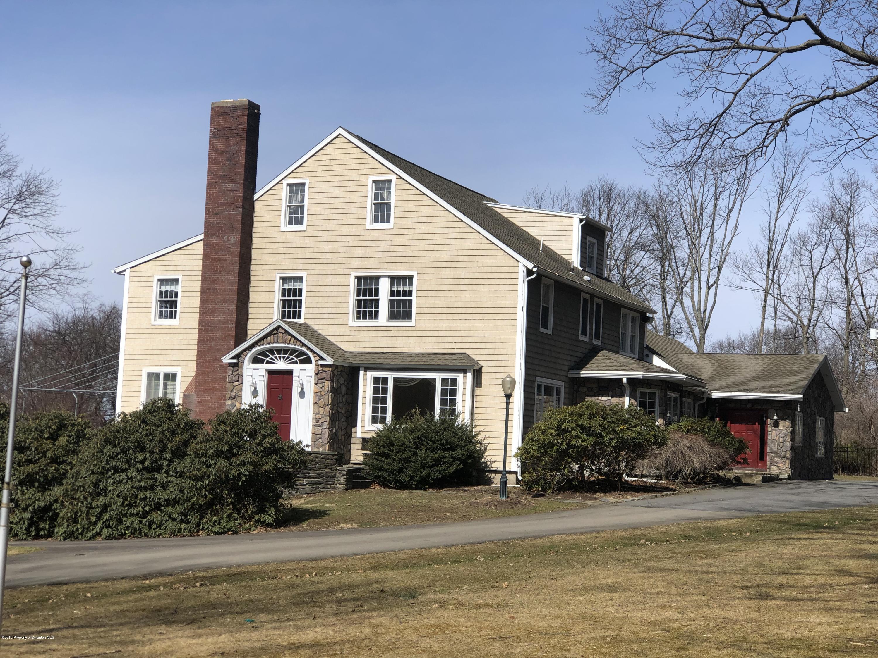 105 Noble Road Clarks Summit, PA 18411 - Photo 2 of 11 a front view of a house with a yard and garage