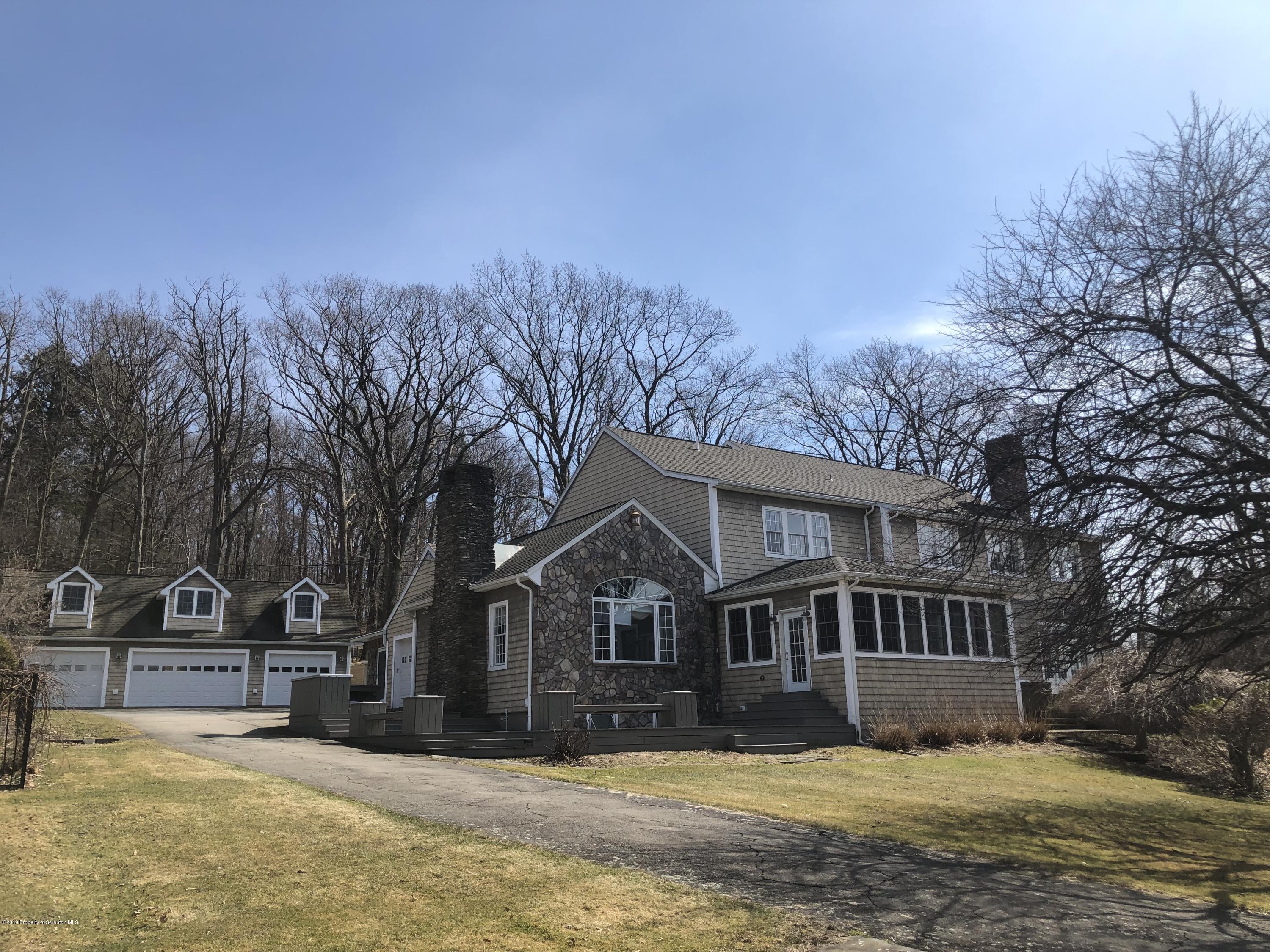 105 Noble Road Clarks Summit, PA 18411 - Photo 3 of 11 a view of a house with a yard covered in snow