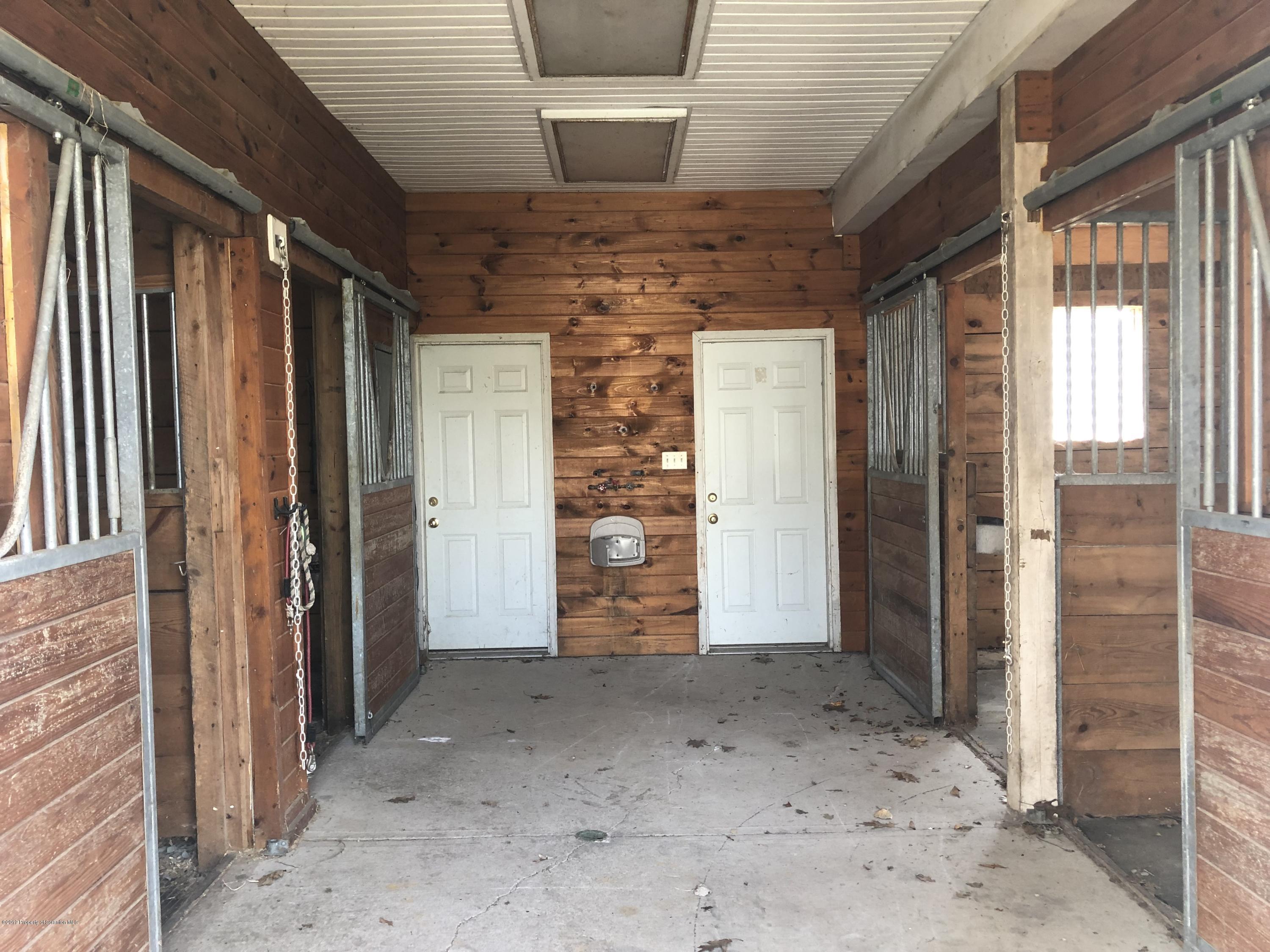 105 Noble Road Clarks Summit, PA 18411 - Photo 5 of 11 a view of a hallway with wooden walls