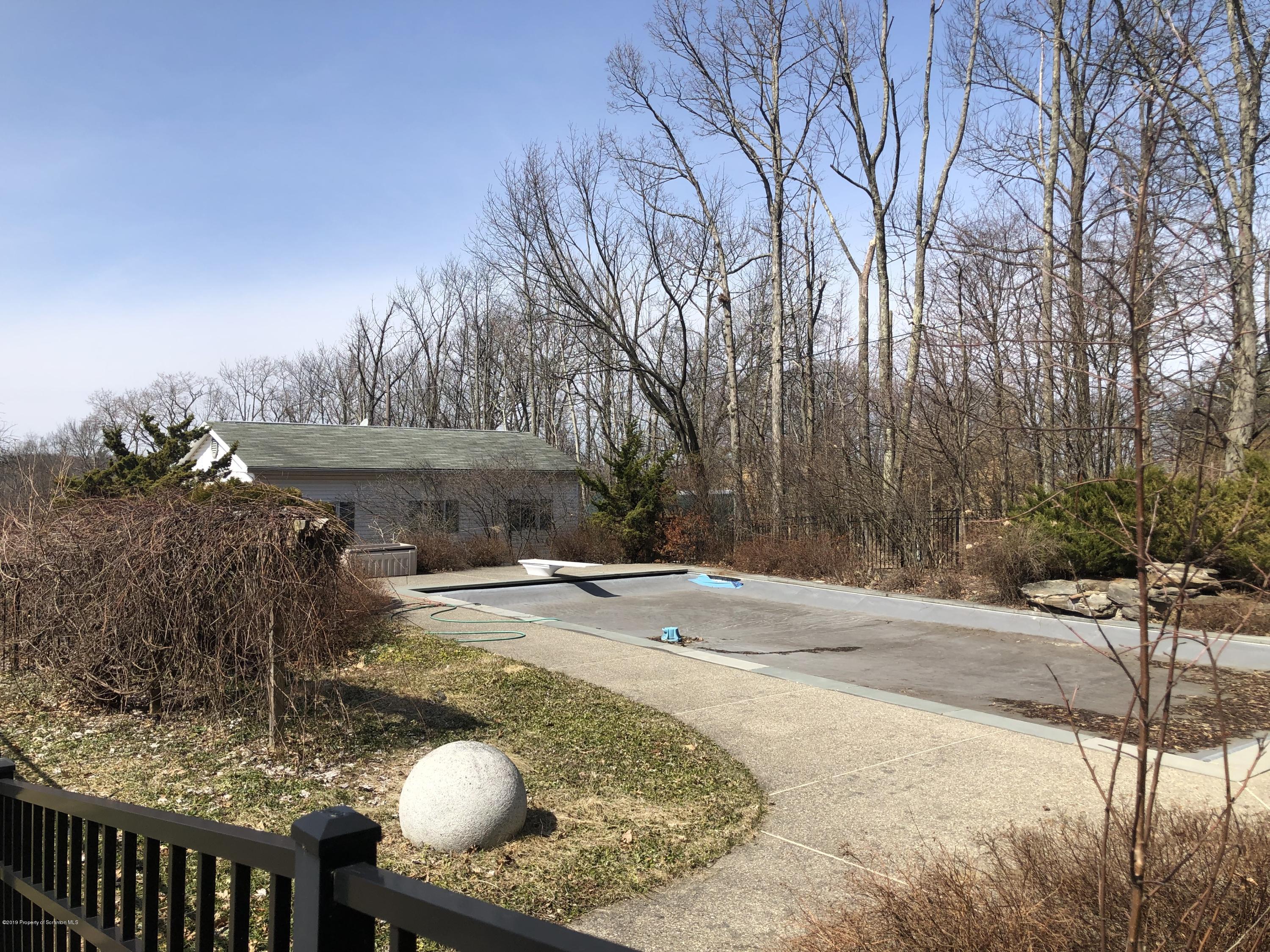 105 Noble Road Clarks Summit, PA 18411 - Photo 10 of 11 a backyard of a house with table and chairs