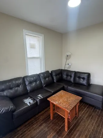 a living room with furniture and a rug