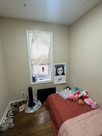 a bedroom with a bed and dresser