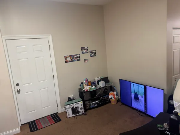 a room with furniture and wooden floor