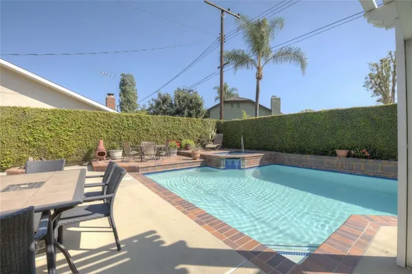 a view of a swimming pool with a patio