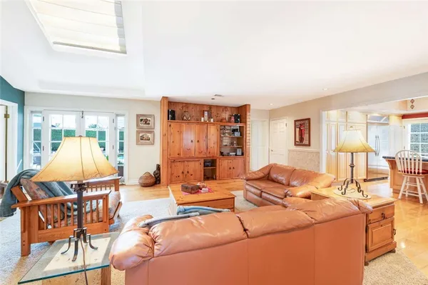 a living room with a couch and a dining table