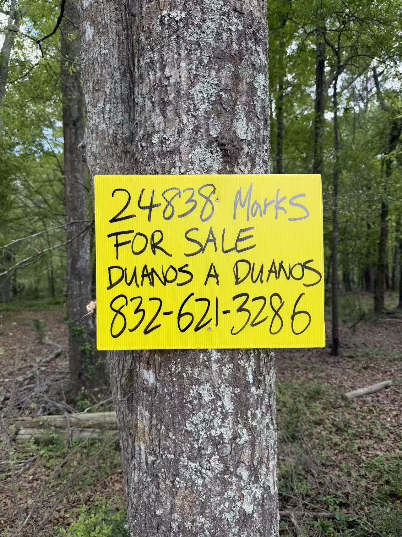 24838 Marks Road Splendora, TX 77372 - Photo 3 of 7 a sign that is on a brick wall