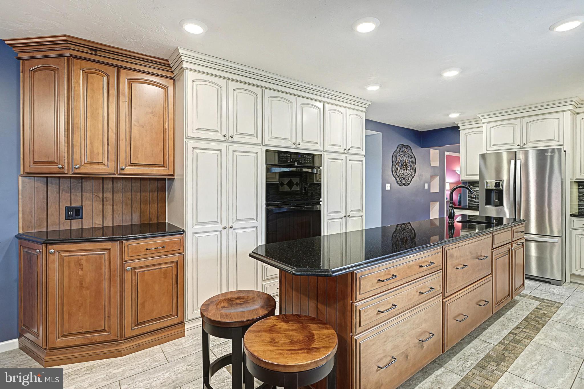 645 Kindig Road Littlestown, PA 17340 - Photo 21 of 61 a kitchen with granite countertop a refrigerator oven stove top oven a sink and dishwasher