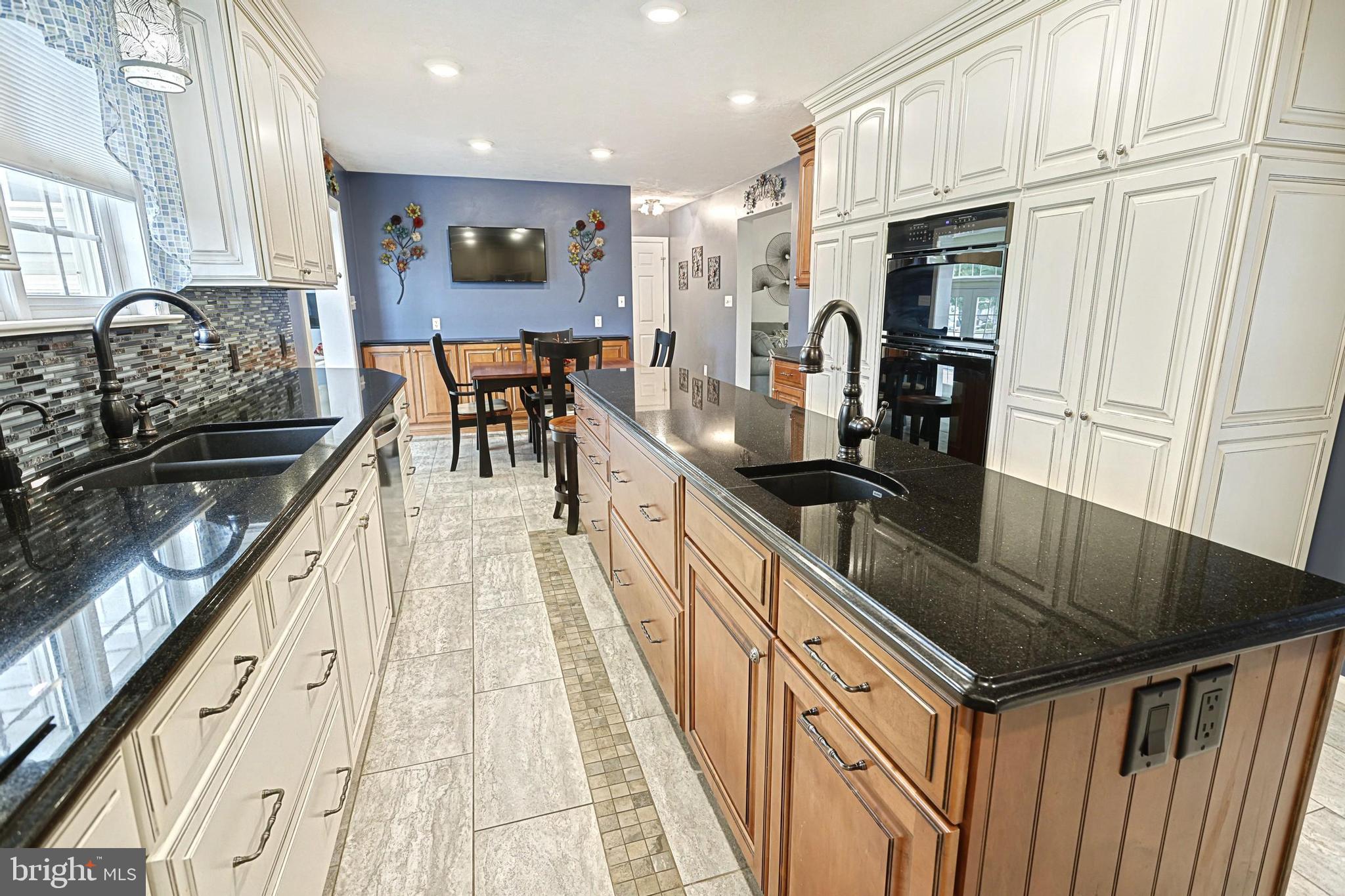 645 Kindig Road Littlestown, PA 17340 - Photo 24 of 61 a kitchen with stainless steel appliances granite countertop a stove a sink and a refrigerator
