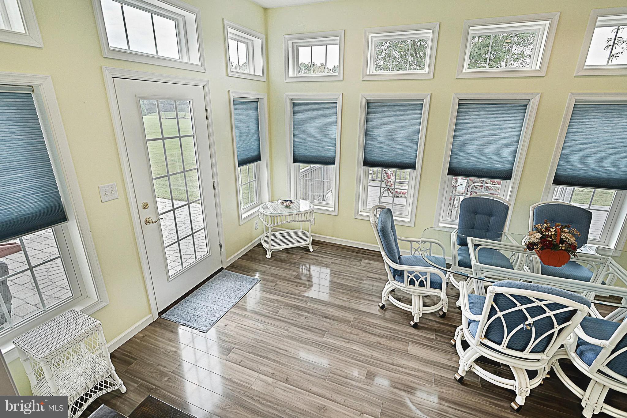 645 Kindig Road Littlestown, PA 17340 - Photo 27 of 61 a living room with furniture and a floor to ceiling window