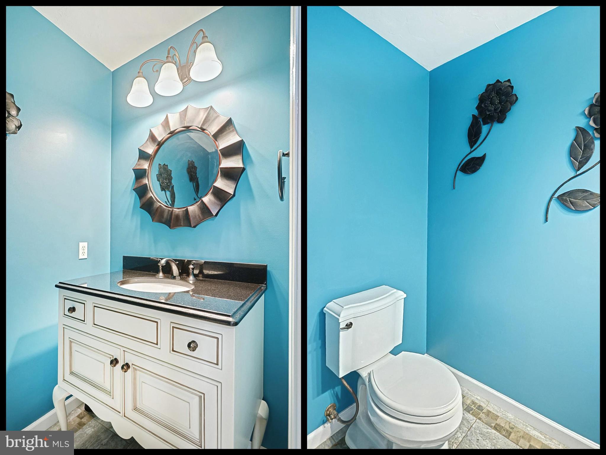 645 Kindig Road Littlestown, PA 17340 - Photo 32 of 61 a bathroom with a toilet sink vanity and mirror