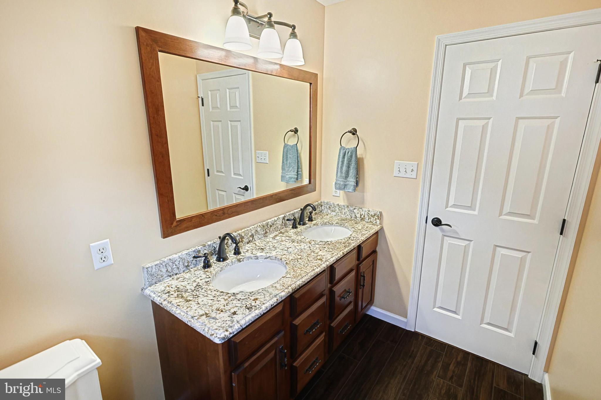 645 Kindig Road Littlestown, PA 17340 - Photo 36 of 61 a bathroom with a sink vanity and a mirror