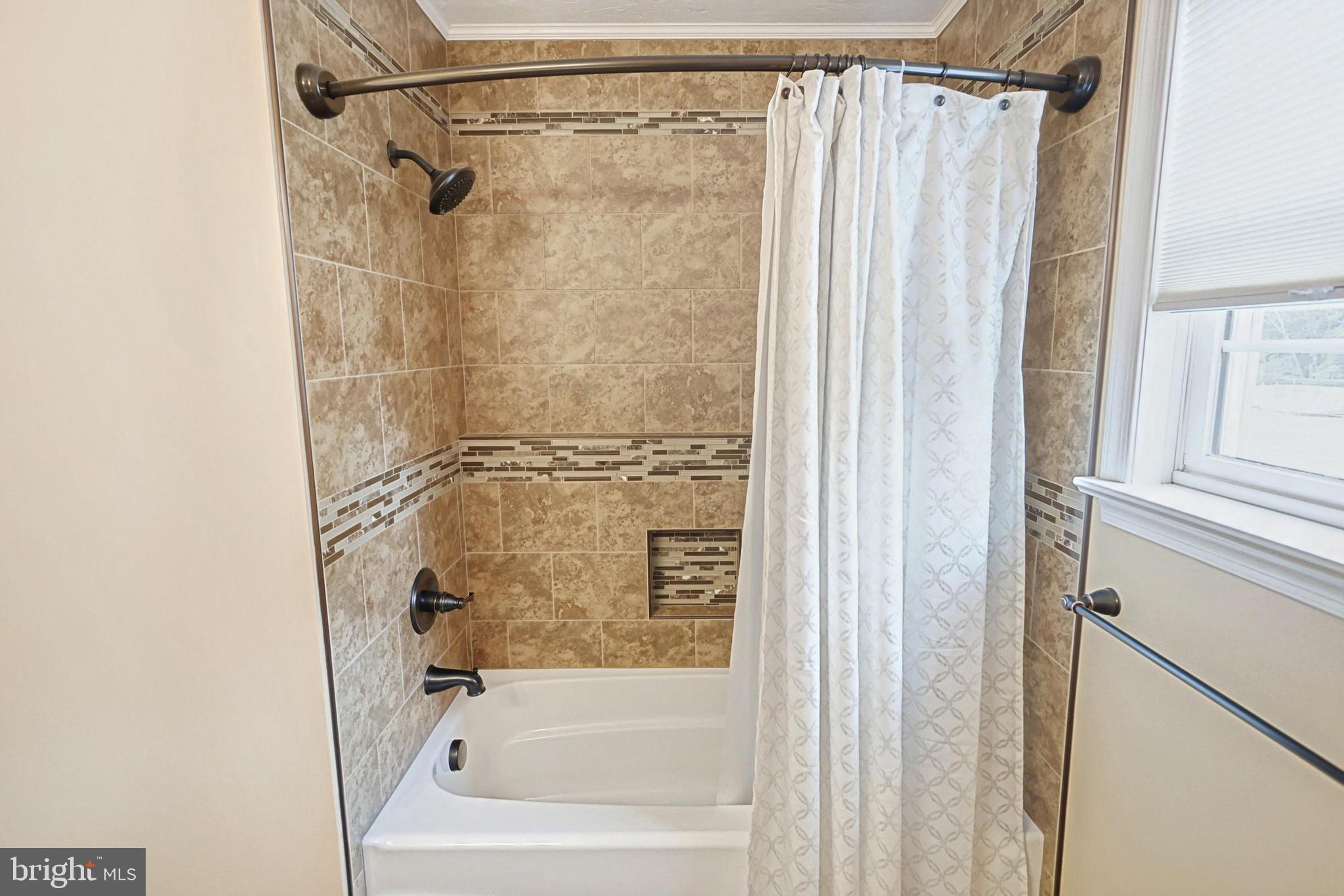 645 Kindig Road Littlestown, PA 17340 - Photo 37 of 61 a bathroom with a shower and a bath tub