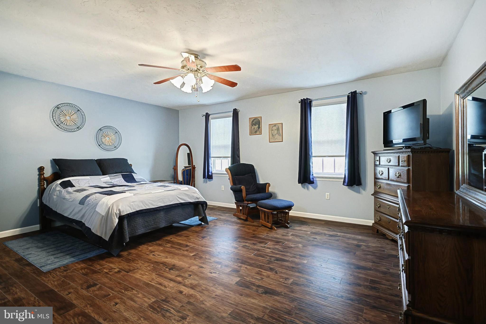 645 Kindig Road Littlestown, PA 17340 - Photo 38 of 61 a bedroom with a bed and a chandelier