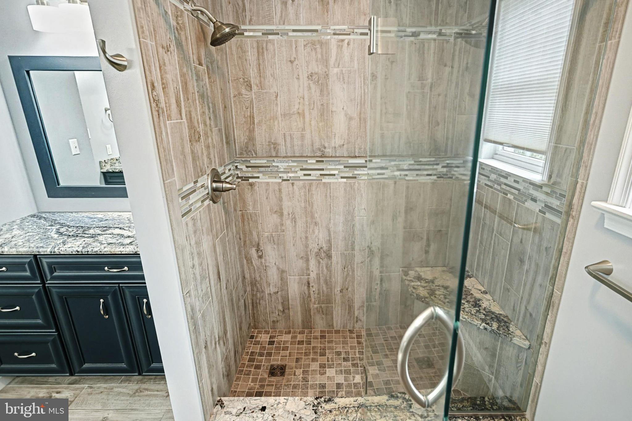 645 Kindig Road Littlestown, PA 17340 - Photo 42 of 61 a bathroom with a granite countertop shower and a sink